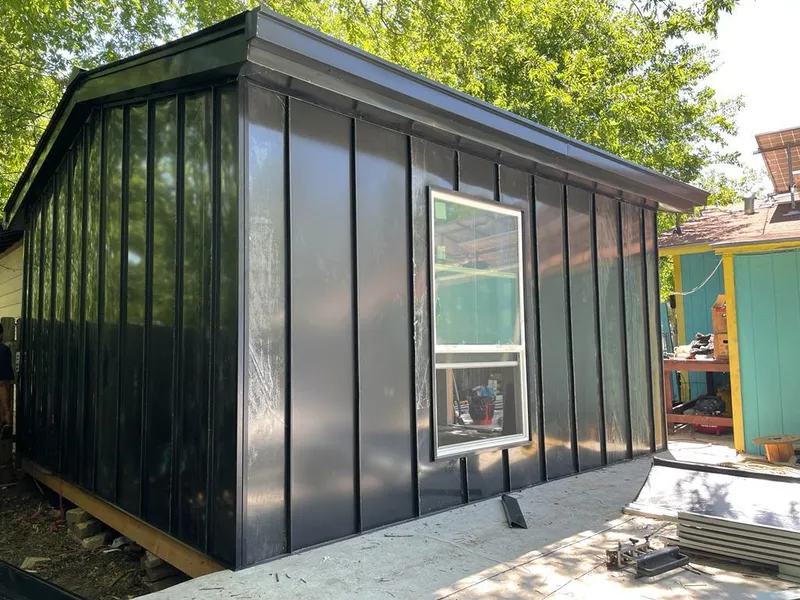 Black standing seam metal wall panels for Roof Inspection in Magnolia